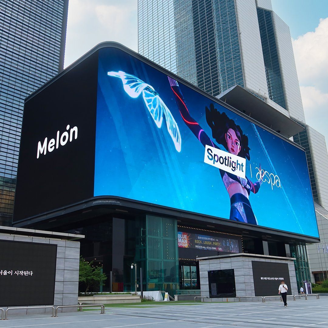 Large outdoor LED display wrapping a commercial building facade
