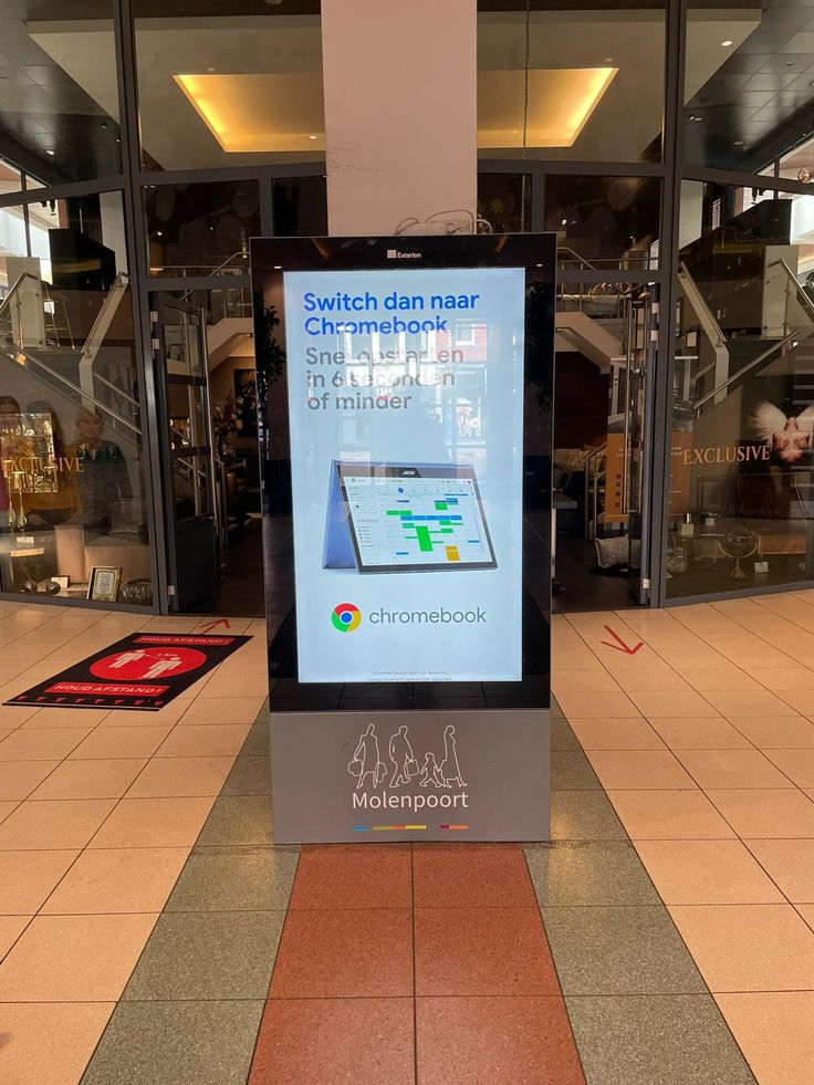 Portrait digital advertising kiosk in a shopping mall displaying interactive content