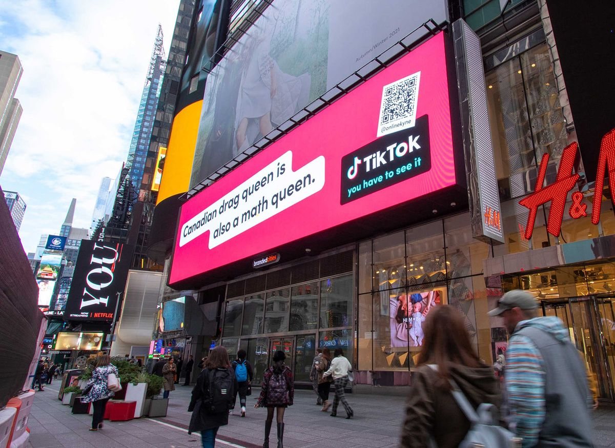 Large outdoor LED advertising screen on a city retail facade