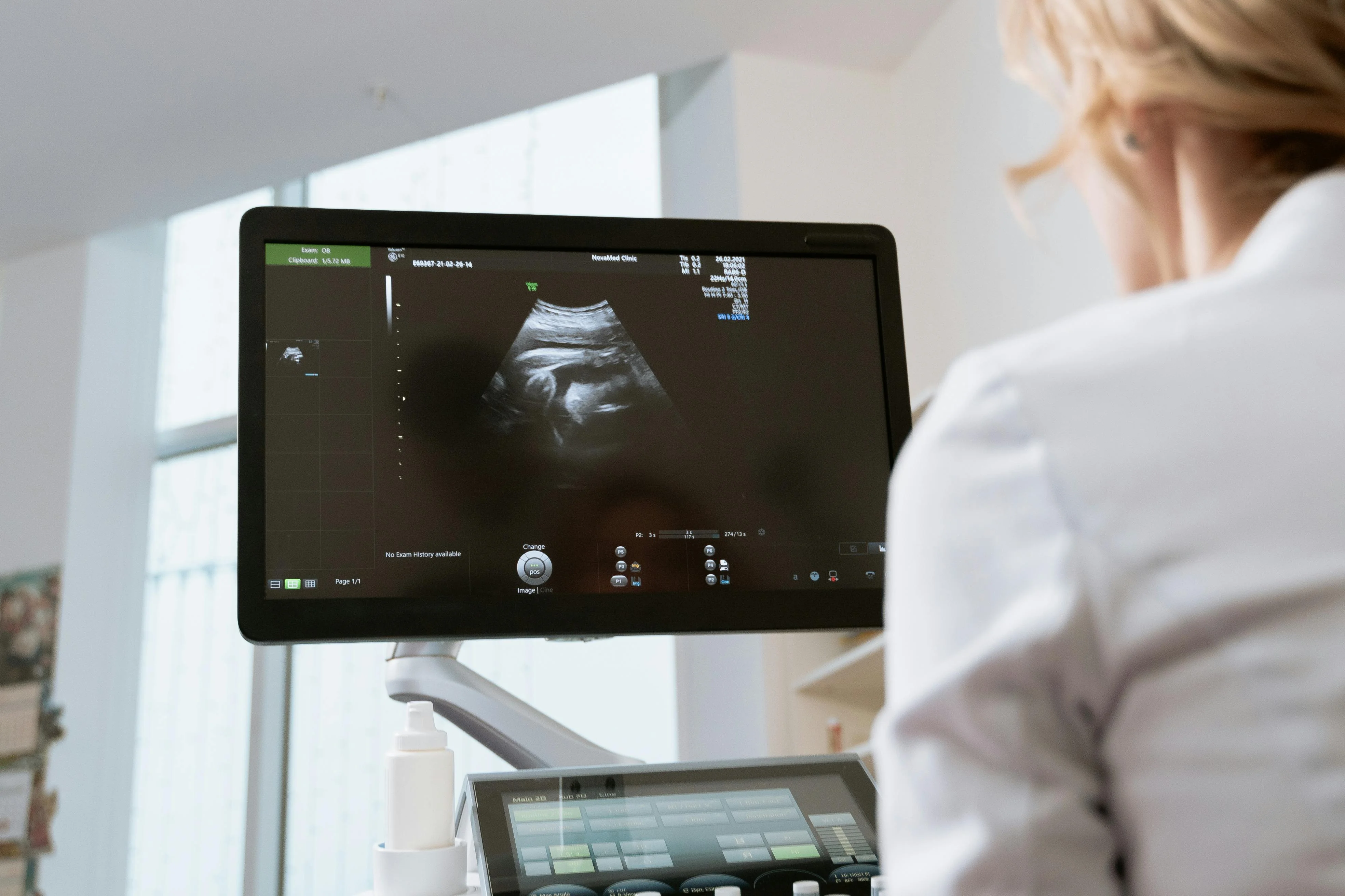 Clinical team reviewing data on a medical-grade touch display