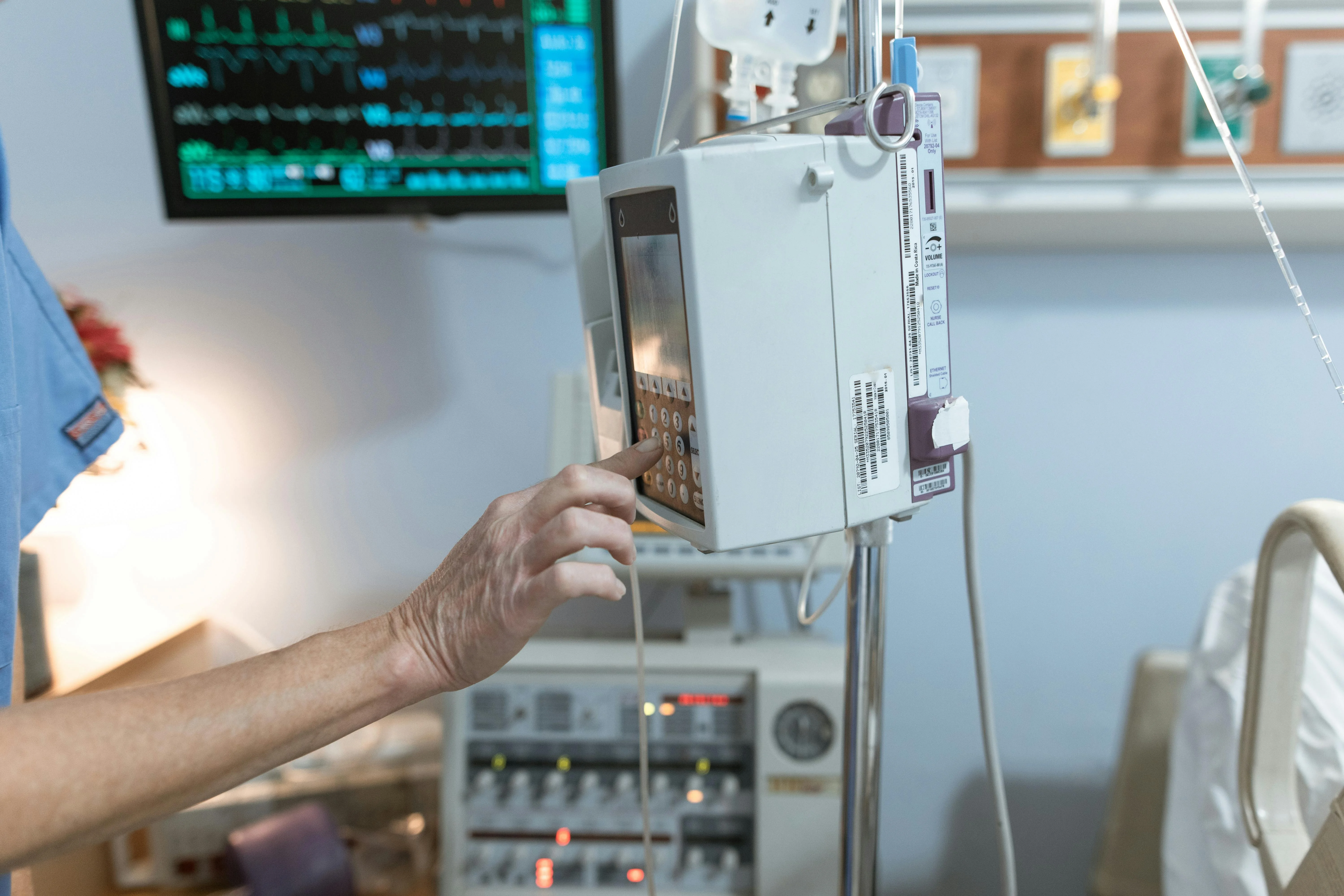 Clinical environment with staff using hygienic touch interfaces at the point of care